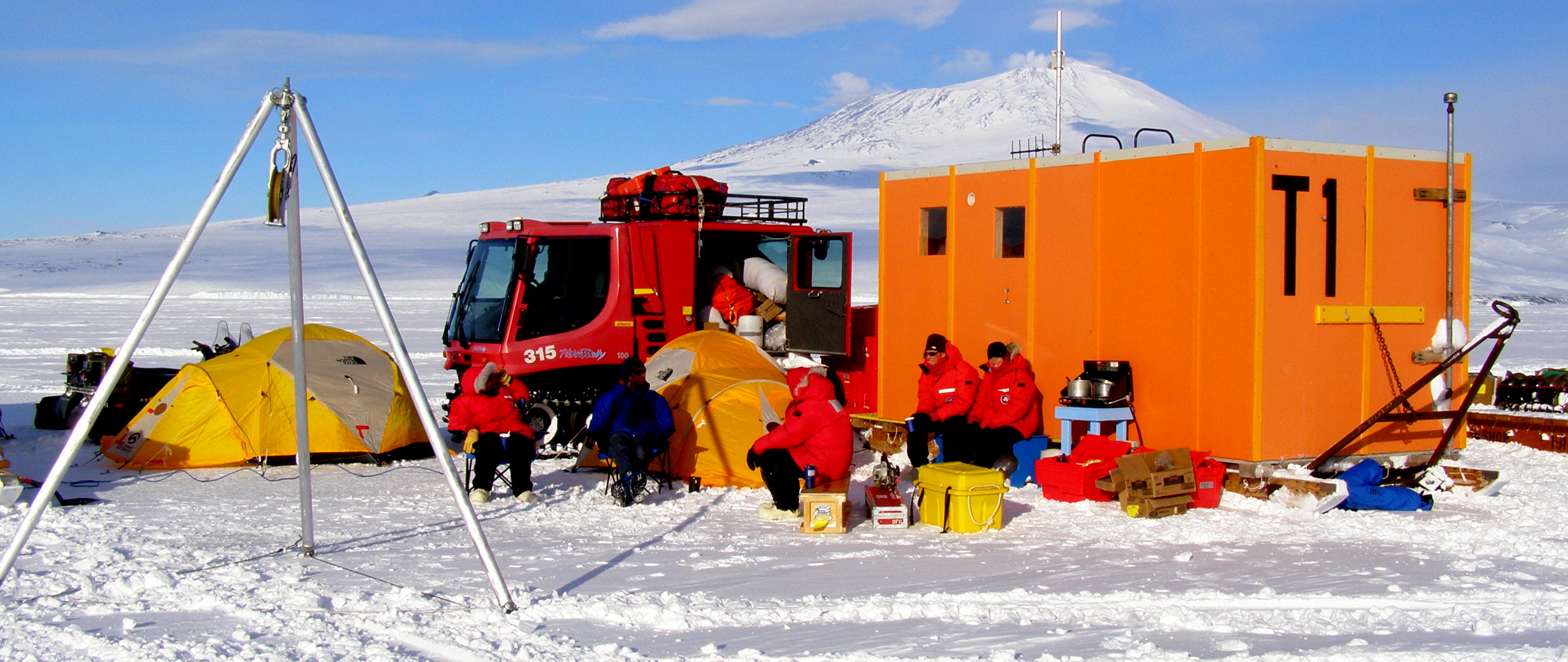 Enjoying some hot beverages out of the wind at Station II ice camp