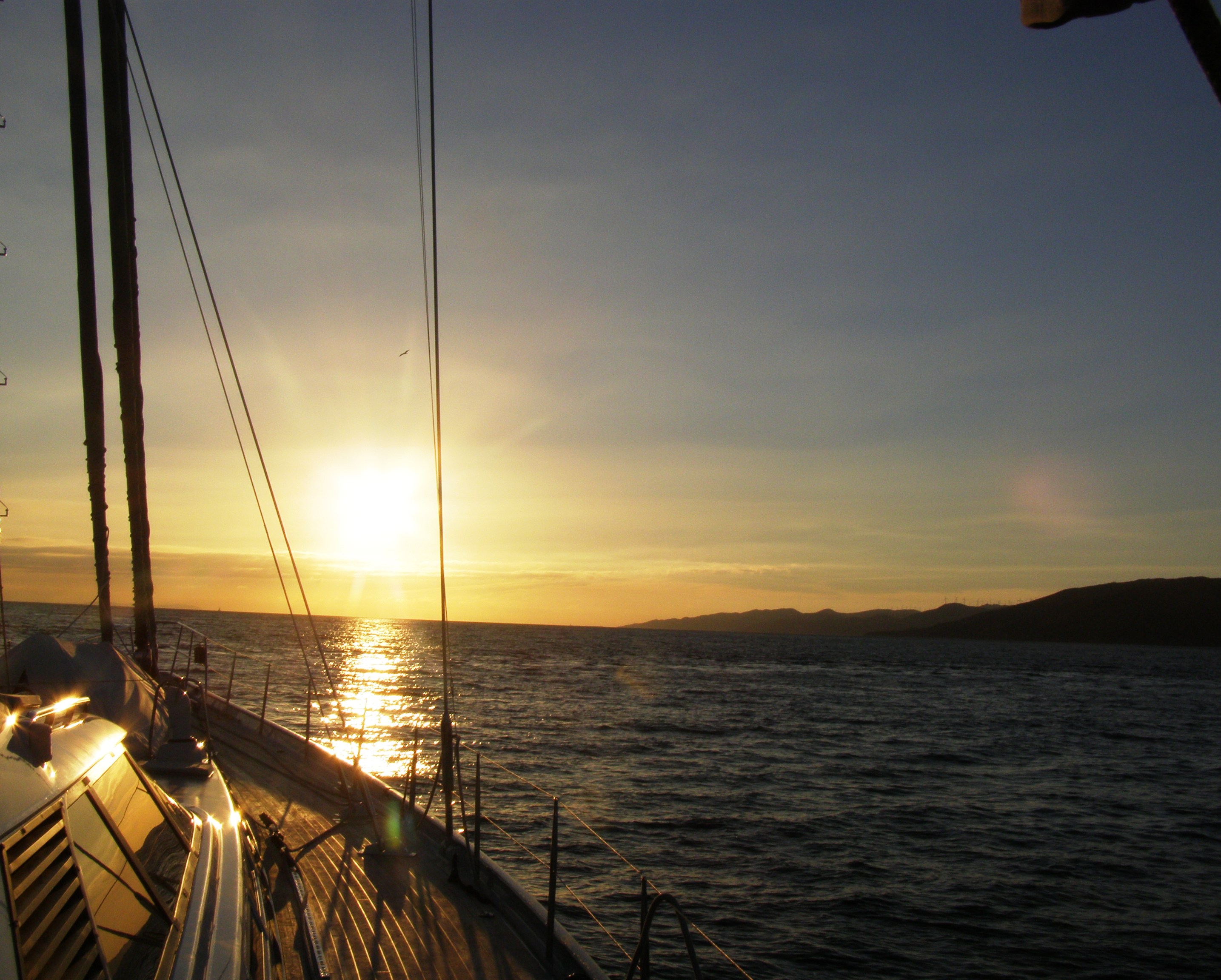 Sailing through the Straits of Gibraltar at sunset