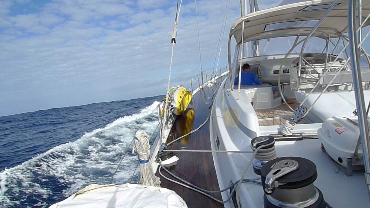 John reading as we surf down waves