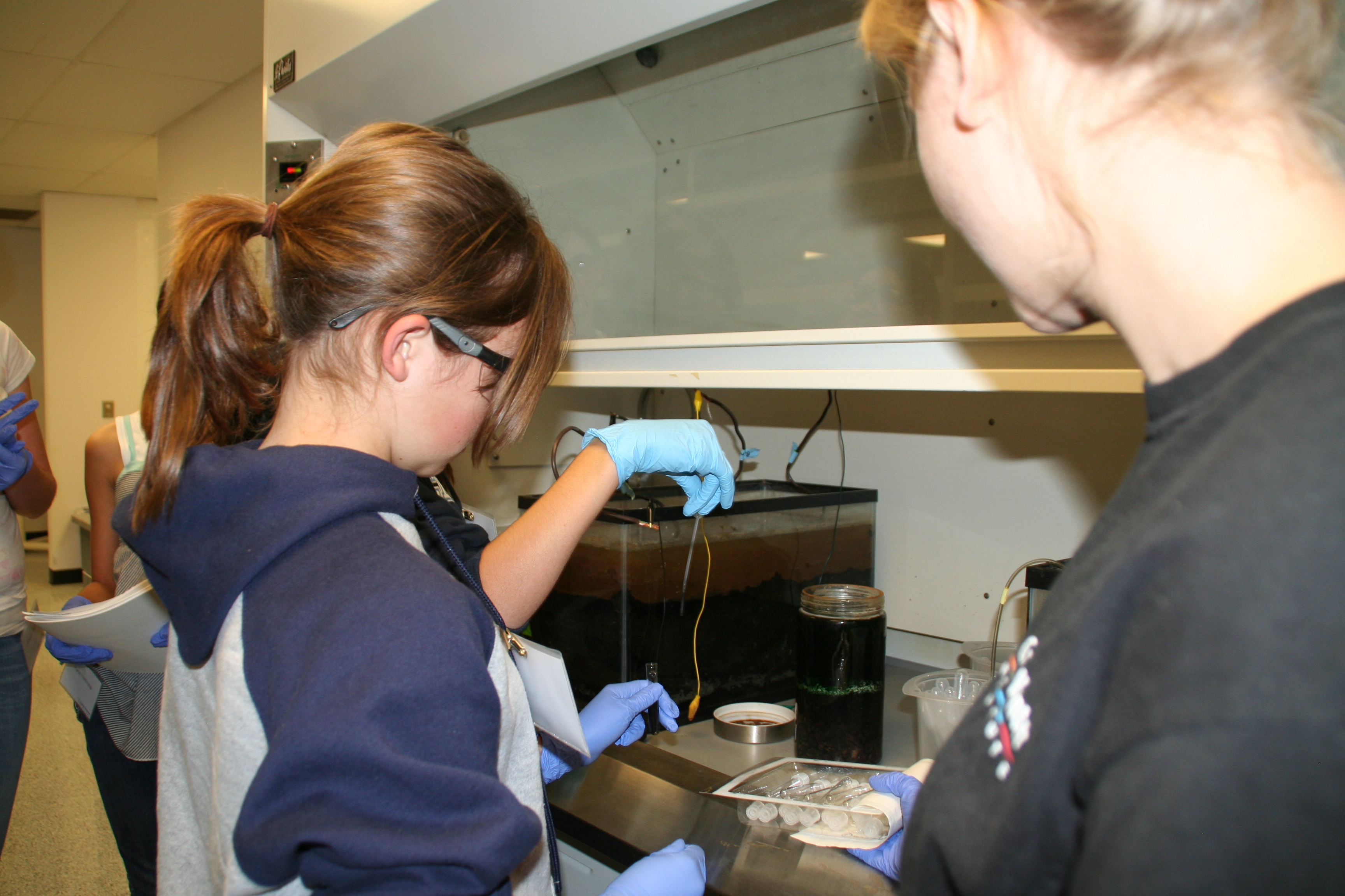 Orianna Bretschger is helping get the mud samples - stinky!!