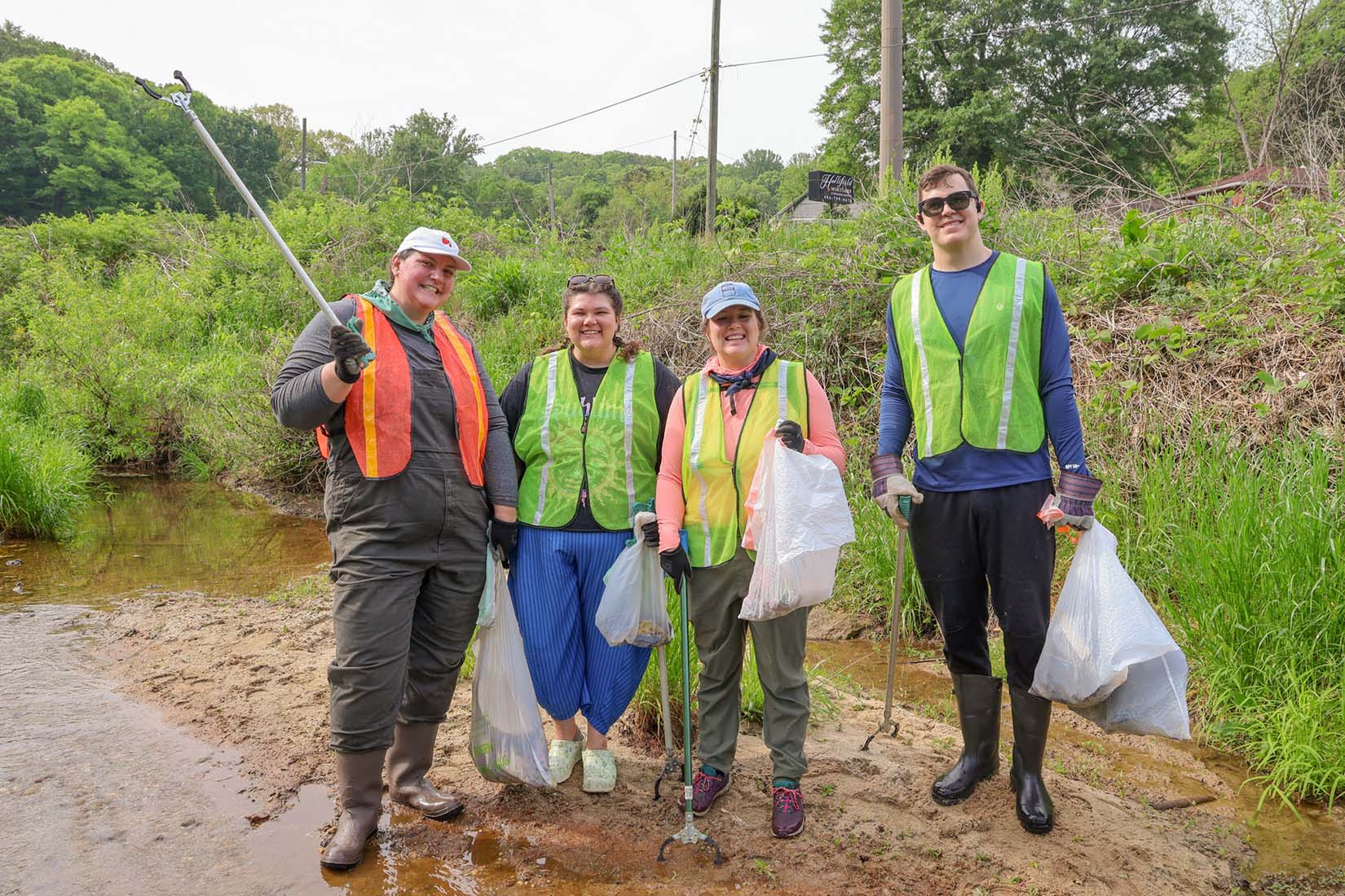 Volunteer holding a nearly empty cleanup bag